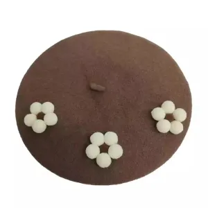 Am??lie Roses Wool Beret boater hat with bow in beach sunlight
