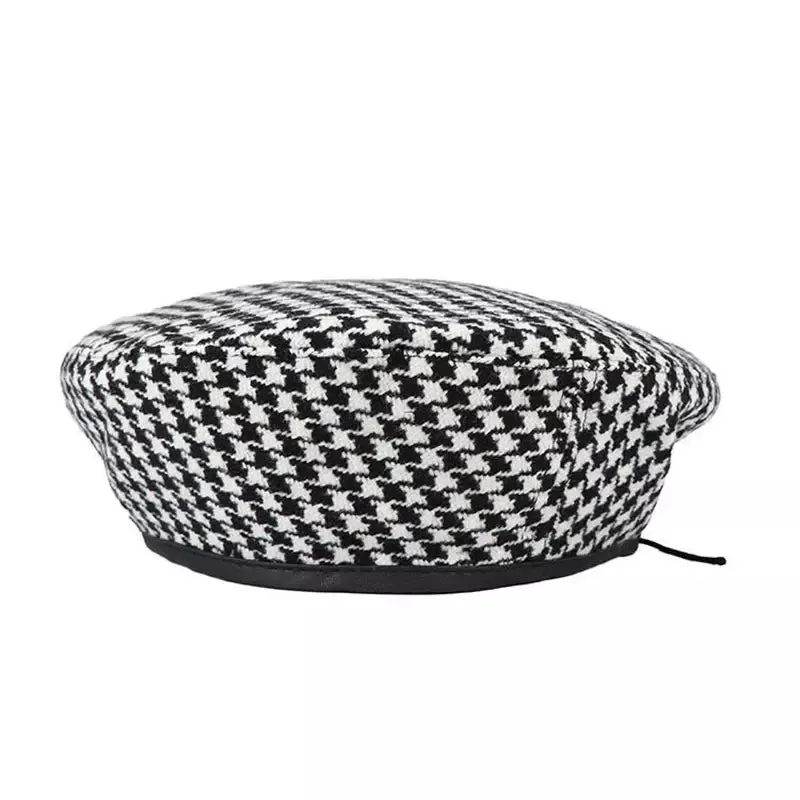 Black & White Houndstooth French Beret boater hat with bow in beach sunlight