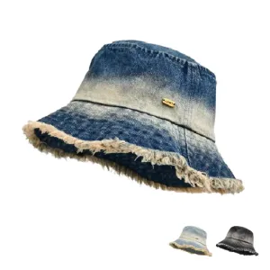 Brookland Faded Denim Bucket Hat boater hat with bow in beach sunlight