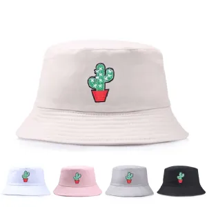 Cactus Cotton Bucket Hat boater hat with bow in beach sunlight