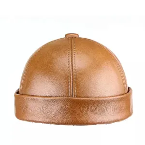 Fairbury Genuine Leather Docker Cap boater hat with bow in beach sunlight