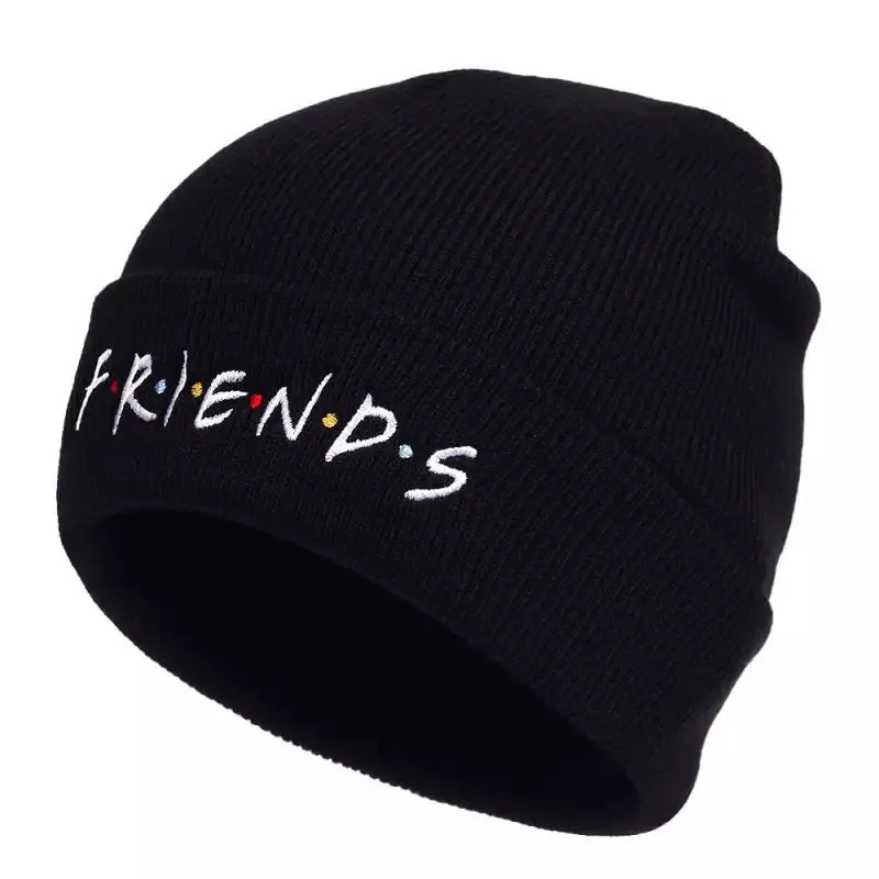 Friends Classic Black Beanie boater hat with bow in beach sunlight