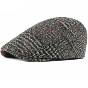 Gimont Tartan Wool Flat Cap boater hat with bow in beach sunlight
