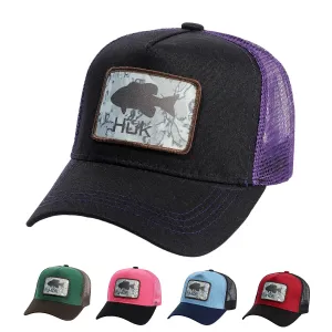 HUK Fishing Gear Trucker Cap boater hat with bow in beach sunlight