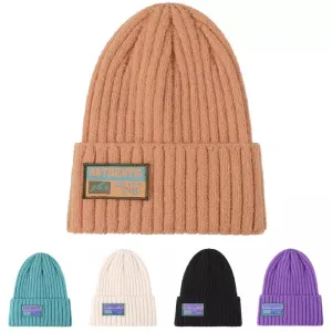 JLA Winter Knitted Beanie boater hat with bow in beach sunlight