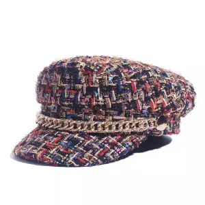 Livorno Knitted Fiddler Cap boater hat with bow in beach sunlight