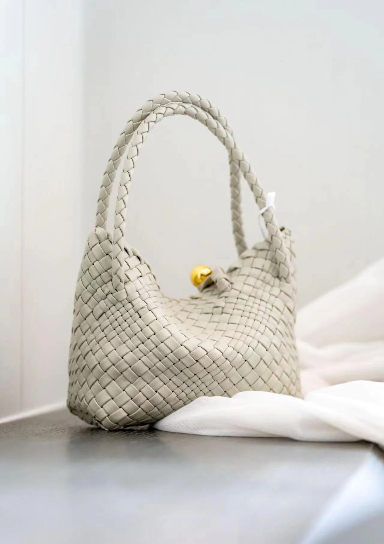 Luxury Handwoven Lambskin Leather Shoulder Bucket Bag with Sculptural Gold Sphere Closure and Double Handle Design ?C Spacious & Versatile Carryall