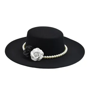 Pearls & Roses Wide Brim Cotton Boater Hat boater hat with bow in beach sunlight