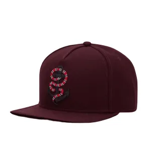 Snake & Anchor Snapback Cap boater hat with bow in beach sunlight