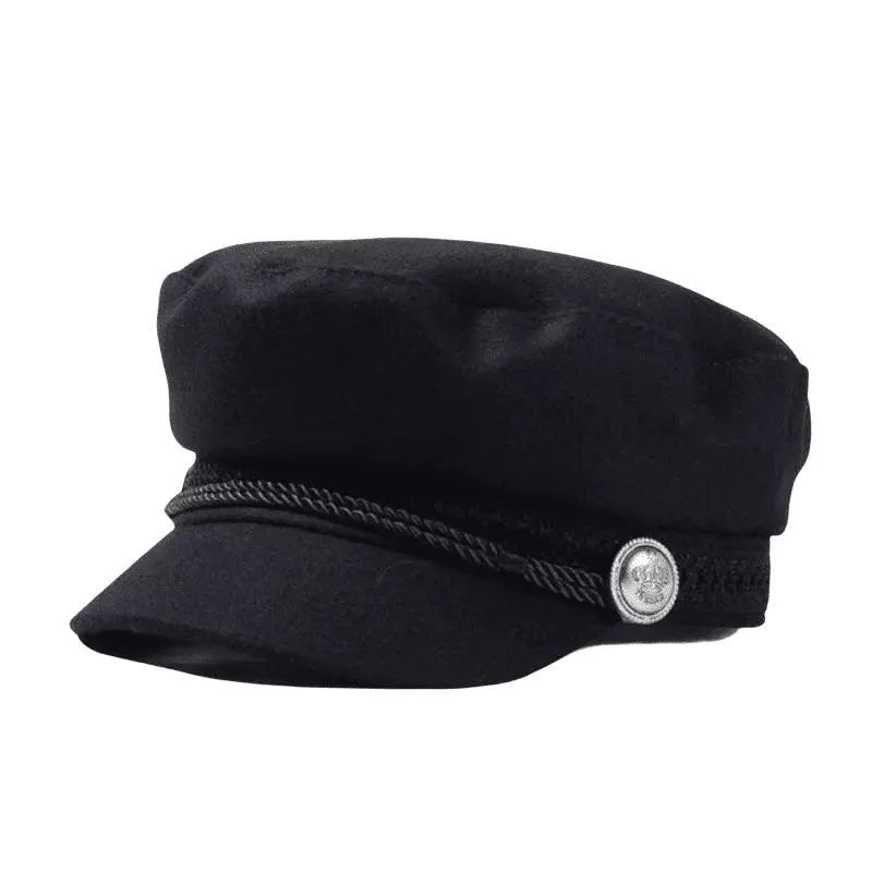 The Crown Black Cotton Sailor Cap boater hat with bow in beach sunlight