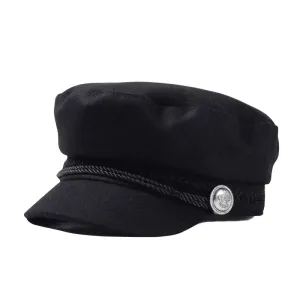 The Crown Black Cotton Sailor Cap boater hat with bow in beach sunlight